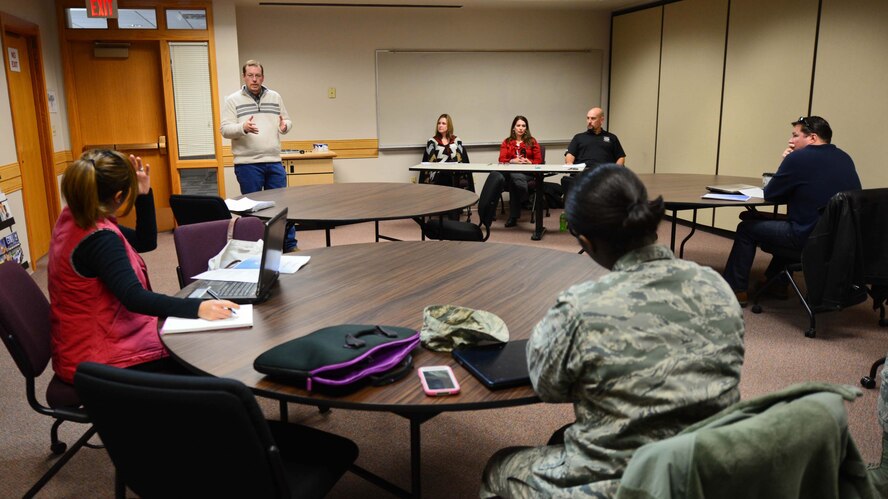 Jeff Hollinshead, 28th Force Support Squadron Airman and Family Readiness Center community ready specialist, gives advice to Airmen and dependents during the Civilian Resume Writing workshop in the AFRC at Ellsworth Air Force Base, S.D., Jan. 7, 2015. During the workshop, leaders  critique and improve resumes to help people succeed in today’s highly competitive work environment. (U.S. Air Force photo by Senior Airman Zachary Hada/Released)

