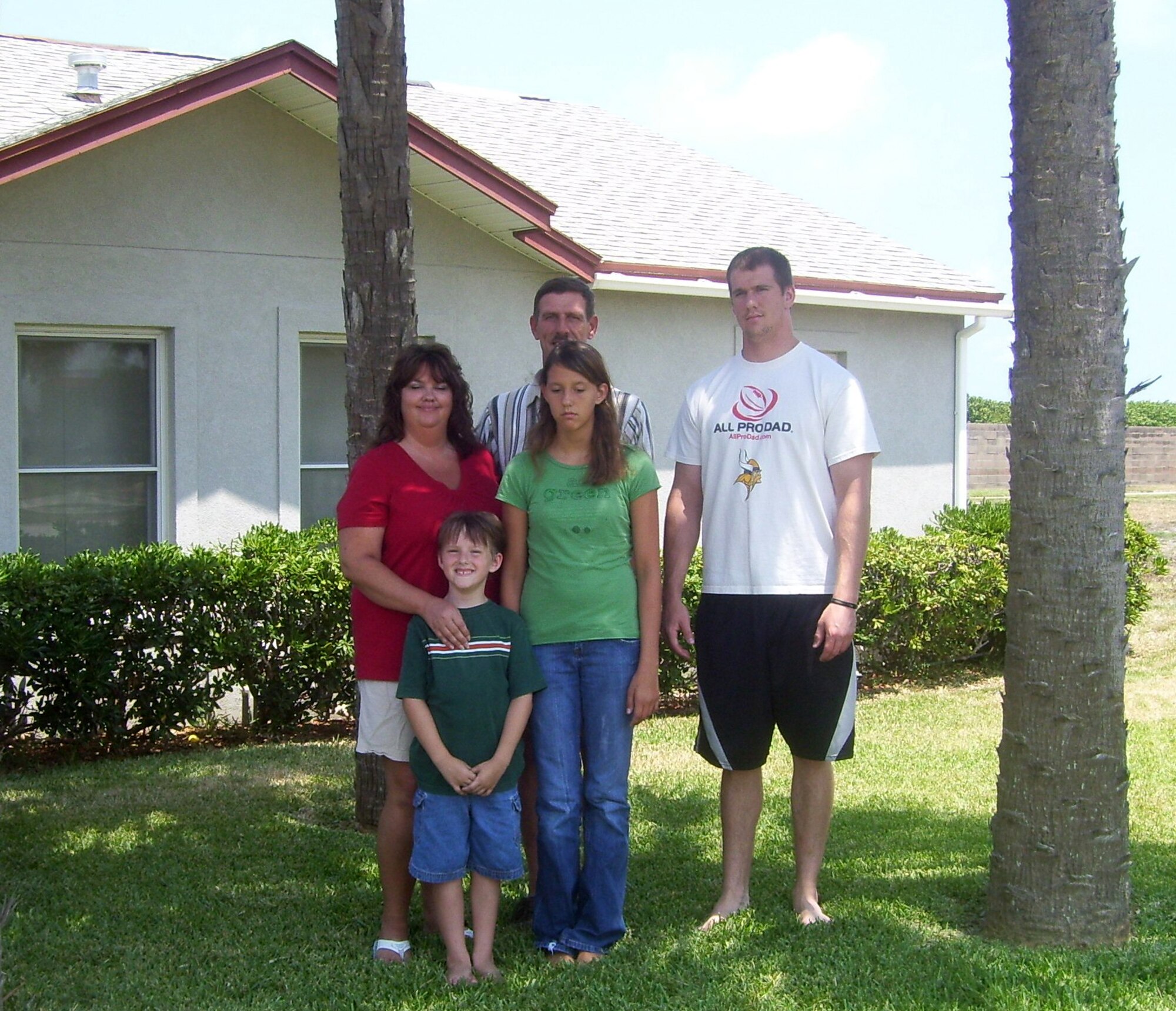 John Nederhoed and his family stand in front of their Patrick Air Force Base, Florida, home shortly after moving to the base in the summer of 2006. The Nederhoeds opted to remain in their base home following John’s retirement in Sept. 2013, providing a smoother transition and continuity for the entire family. (Courtesy photo)