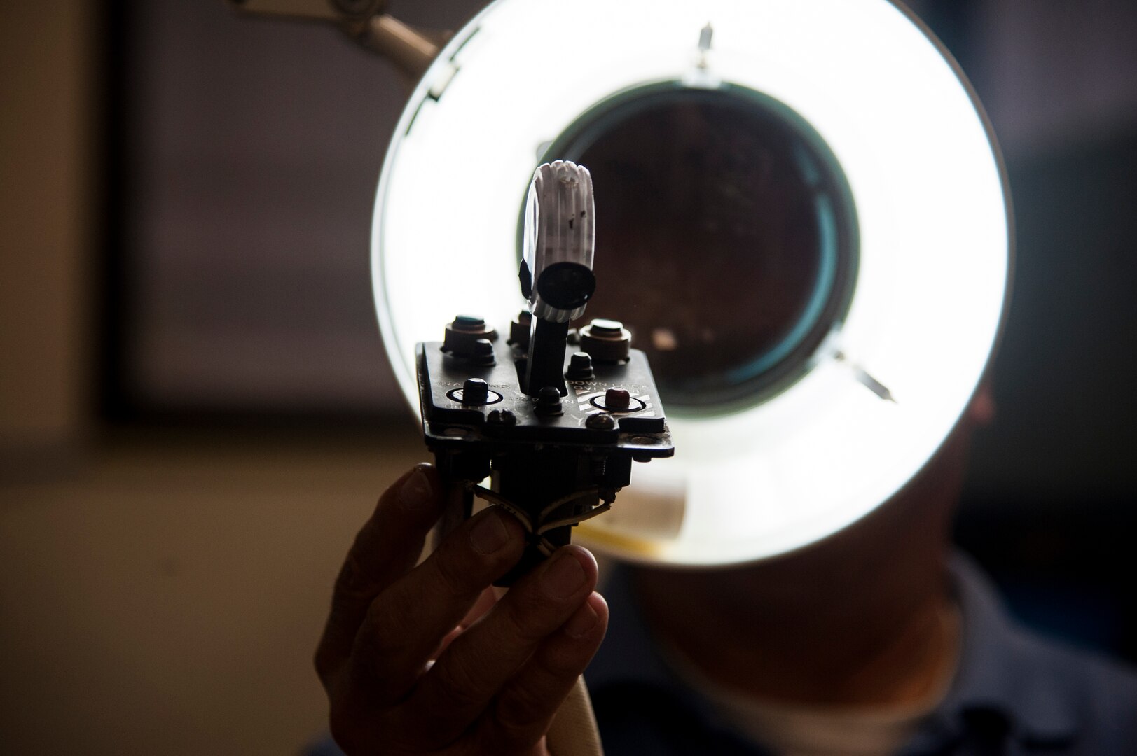 Vincent Canchola, 12th Flying Training Wing Maintenance Group electrical equipment technician, inspects a landing gear control handle from a T-38 Talon Jan. 8, 2015. By using continuous process improvement, the 12th FTW/MX was able to decrease the turnaround time for T-38 Talon parts from 62.5 hours to 21 hours.  (U.S. Air Force photo by Airman 1st Class Stormy Archer)