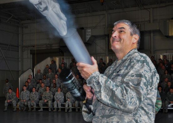 Col. Jim Phillips, the 919th Special Operations Wing commander, launches a t-shirt into the crowd with a cannon to promote the wing’s March 7 combat dining-in event Jan. 11 at Duke Field, Fla.  To purchase tickets, contact any 919th SOW chief master sergeant to purchase tickets. (U.S. Air Force photo/Dan Neely)