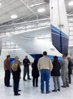 Master Sgt. John Wood, a 711th Special Operations Squadron combat aviation advisor, tells the 919th Special Operations Wing’s newly-installed honorary commanders about the C-145 aircraft Jan. 10, at Duke Field, Fla.  The honorary commander program helps educate local civic leaders on the mission of the 919th Special Operations Wing and the Air Force Reserve and helps commanders stay connected with the local community. (U.S. Air Force photo/Dan Neely)