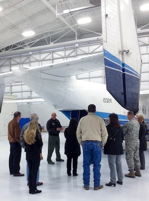 Master Sgt. John Wood, a 711th Special Operations Squadron combat aviation advisor, tells the 919th Special Operations Wing’s newly-installed honorary commanders about the C-145 aircraft Jan. 10, at Duke Field, Fla.  The honorary commander program helps educate local civic leaders on the mission of the 919th Special Operations Wing and the Air Force Reserve and helps commanders stay connected with the local community. (U.S. Air Force photo/Dan Neely)