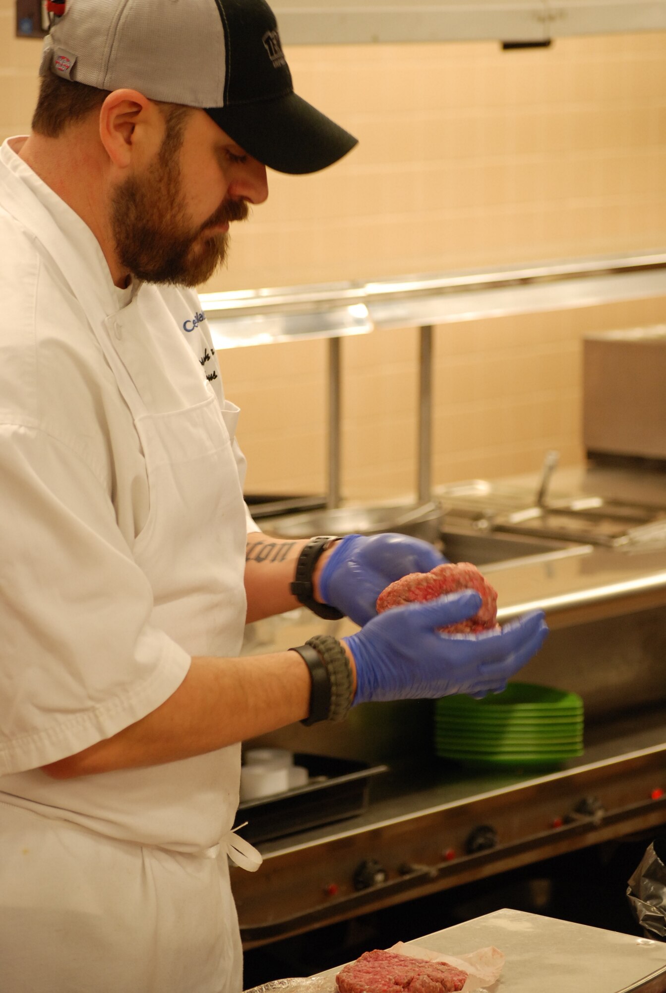 PETERSON AIR FORCE BASE, Colo. -- 21st Force Support Squad Peterson Club Chef Joe Zamora handcrafts burger patties for the new gourmet hamburger line offered at the Club. The new six-burger lineup features brew pub-style burgers with a variety of toppings. (U.S. Air Force photo by Dave Smith)