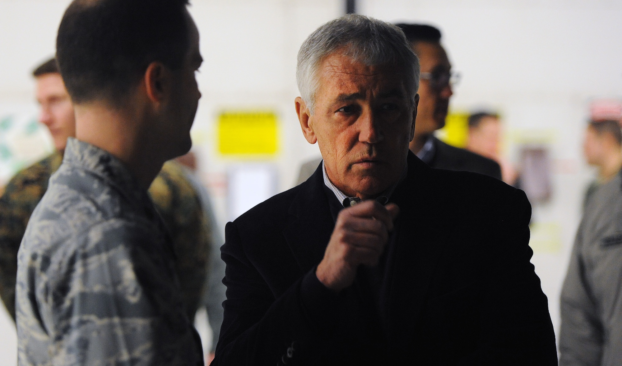 Secretary of Defense Chuck Hagel talks with Maj. Aaron Hager about the capabilities of the B-2 Spirit Jan. 13, 2015 at Whiteman Air Force Base, Mo.  The B-2 can bring massive firepower to bear, in a short time, anywhere on the globe through previously impenetrable defenses, which is why it is so well-suited to its deterrence mission. (U.S. Air Force photo by Airman 1st Class Jovan Banks/Released)