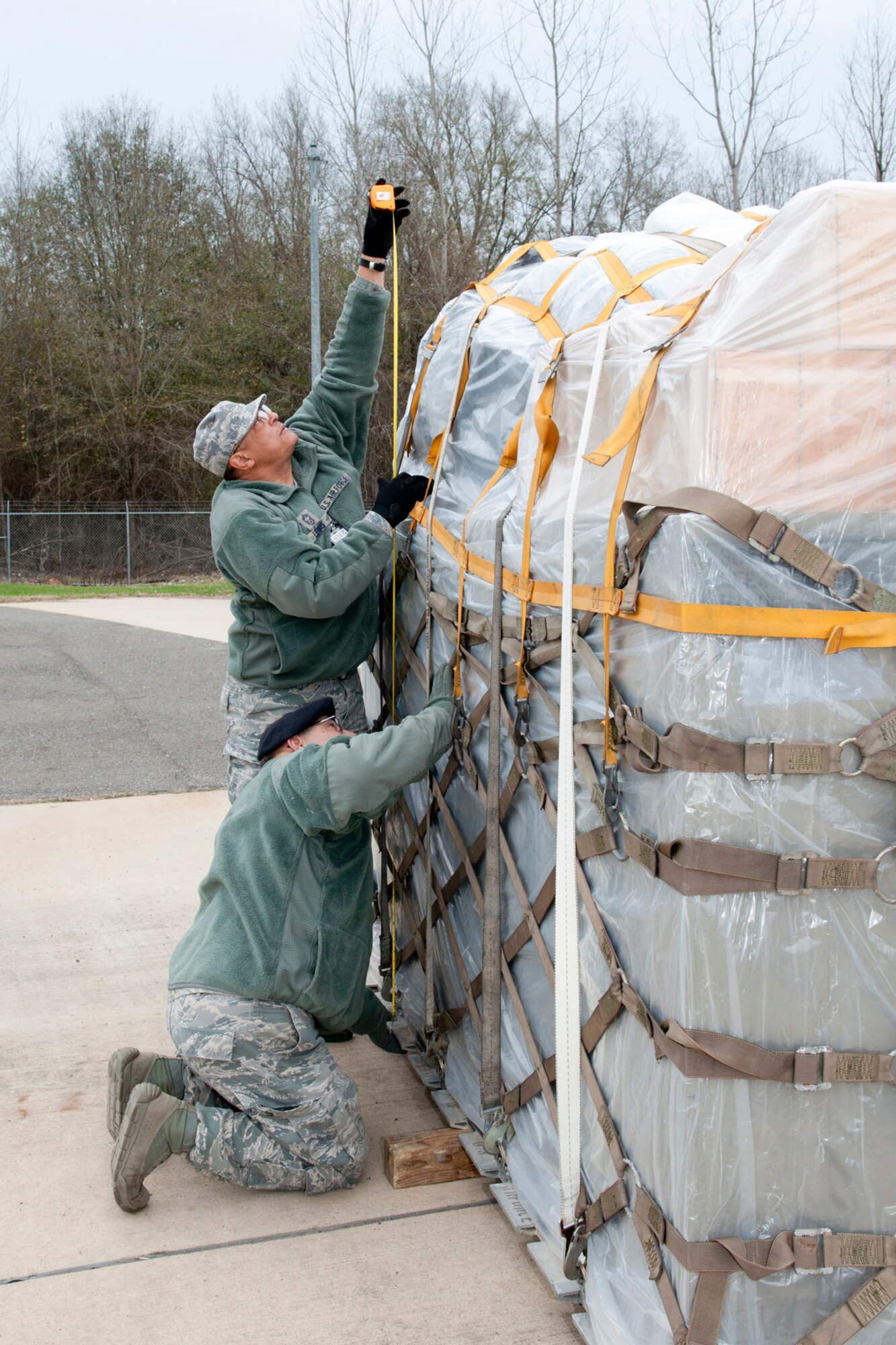 U. S. Air Force Chief Master Sgt. Jerome Lewis measures the height of a loaded aircraft pallet as part of his inspection of the 307th Security Forces Squadron, Jan. 9, 2015, Barksdale Air Force Base, La. The inspection was part of a mobility exercise for the 307th Bomb Wing during the January Unit Training Assembly. (U.S. Air Force photo by Master Sgt. Dachelle Melville/Released)