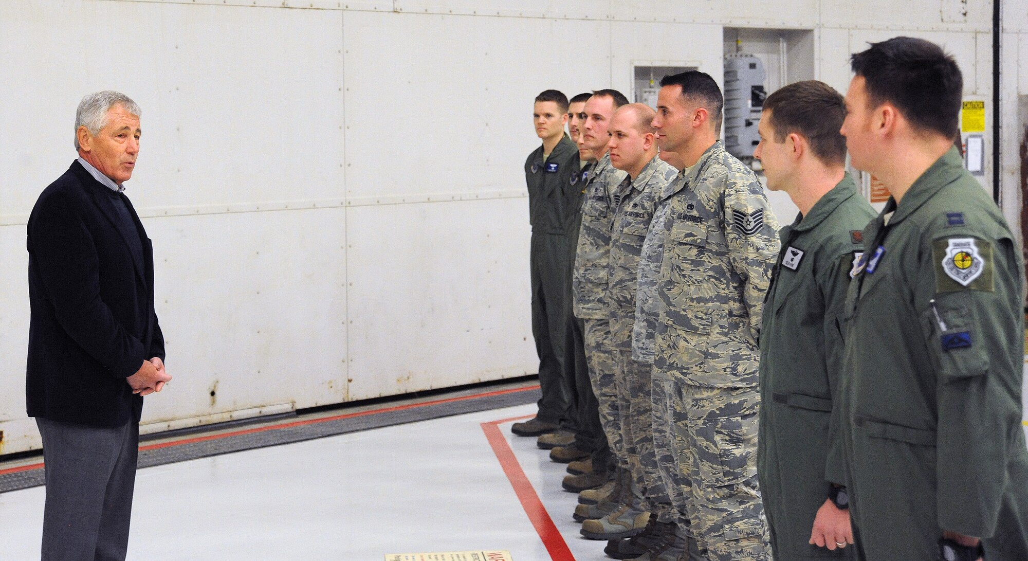Secretary of Defense Chuck Hagel talks with Airmen of Whiteman Air Force Base, Mo. about their hometown as well as their current mission as pilots at Whiteman Air Force Base, Mo. Jan. 13, 2015. (U.S. Air Force photo by Airman 1st Class Jovan Banks/Released)