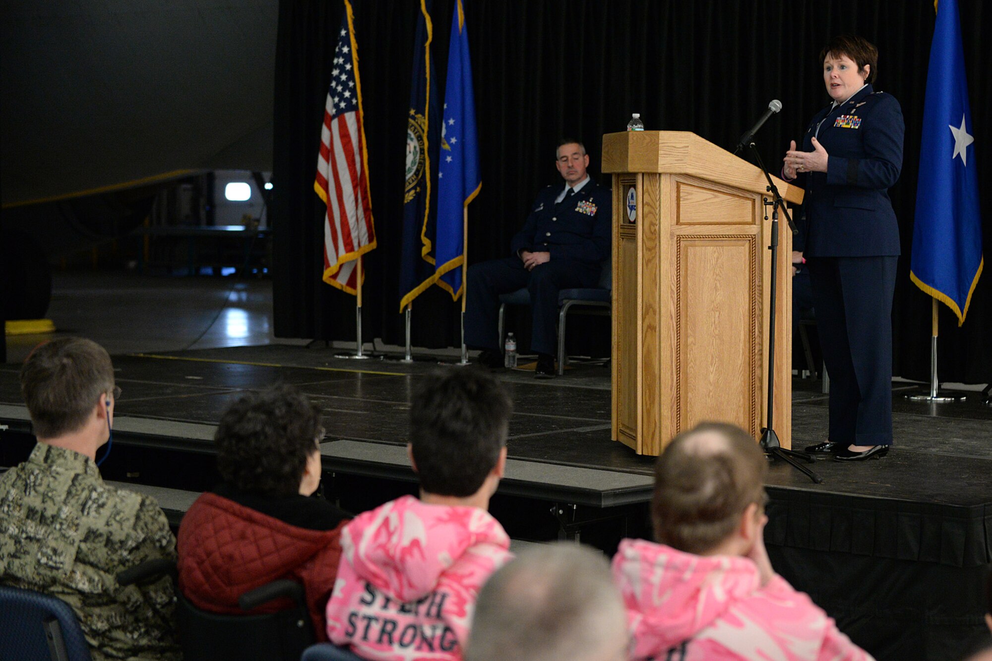 Brig. Gen. Gretchen S. Dunkelberger, Air National Guard assistant to Gen. Dorothy A. Hogg, speaks at the podium during a posthumous retirement ceremony for Lt. Col. Stephanie Riley on base Jan. 10. Dunkelberger, former commander of the 157th Medical Squadron, commanded the organization when Riley who was a nurse at the clinic. (U.S. Air National Guard photo by Tech. Sgt. Mark Wyatt)