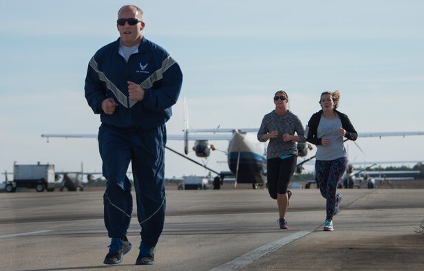 Participants run the flight line route during the Resolution 5k run Jan. 10 at Duke Field, Fla.  The proceeds benefit the Senior Airman Josh Santos Memorial.  More than 50 people participated.  (U.S. Air Force photo/Tech. Sgt. Jasmin Taylor) 