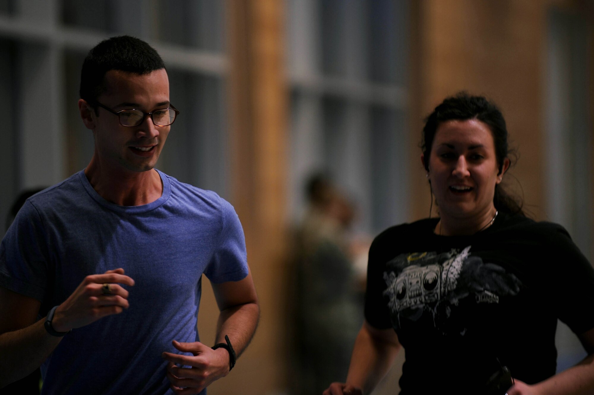 U.S. Air Force Senior Airman Andres Gomez, native of Orlando, Fla., left, and U.S. Air Force Staff Sgt. Bethane Pasechnyk, native of Norwalk, Ohio, both 52nd Aerospace Medicine Squadron bioenvironmental technicians, run together during the Turbo-Charged Challenge #1 at the Eifel Powerhaus at Spangdahlem Air Base, Germany, Jan. 13, 2015. Seventeen individuals participated in the first challenge, which is the first of three weight-loss challenges in the Largest Loser campaign. (U.S. Air Force photo by Airman 1st Class Timothy Kim/Released)