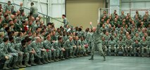 Chief Master Sgt. Tom Mason, 919th Special Operations Wing, starts the wave during the annual 919th Special Operations Wing commander’s call Dec. 7, at Duke Field Fla.  Col. Jim Phillips, 919th SOW commander, briefed on safety, sexual assault prevention and took questions from the audience.  (U.S. Air Force photo by Tech. Sgt. Jasmin Taylor)