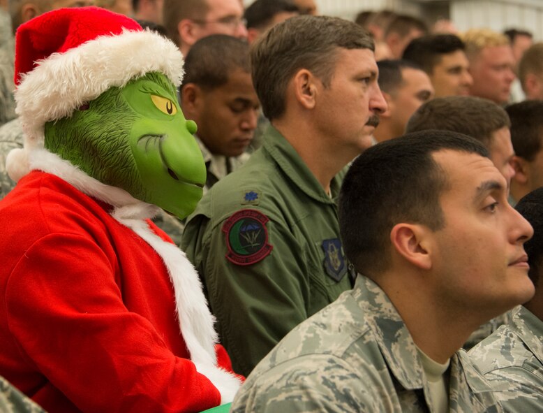 The Grinch makes an appearance during the annual 919th Special Operations Wing commander’s call Dec. 7, at Duke Field Fla.  Col. Jim Phillips, 919th SOW commander, briefed on safety, sexual assault prevention and took questions from the audience.  (U.S. Air Force photo by Tech. Sgt. Cheryl Foster)