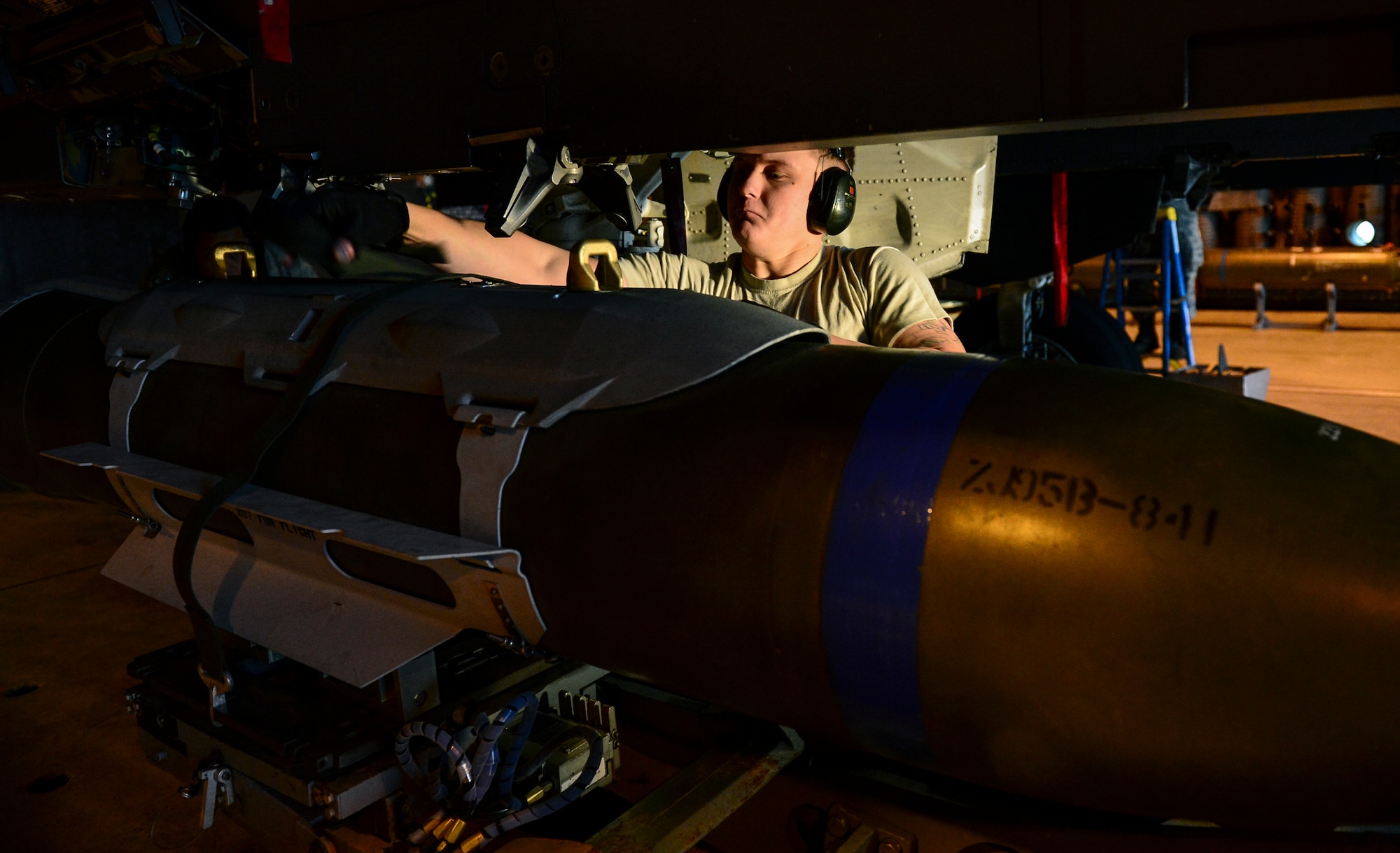 Staff Sgt. Vasiliy Zorin, 494th Aircraft Maintenance Unit weapons load crew chief, inspects a Guided Bomb Unit-31 munition during the Load Crew of the Quarter competition at Royal Air Force Lakenheath, England, Jan. 12, 2015. The competition featured load crew teams from the 492nd, 493rd and 494th AMUs. (U.S. Air Force photo by Airman 1st Class Erin R. Babis/Released)