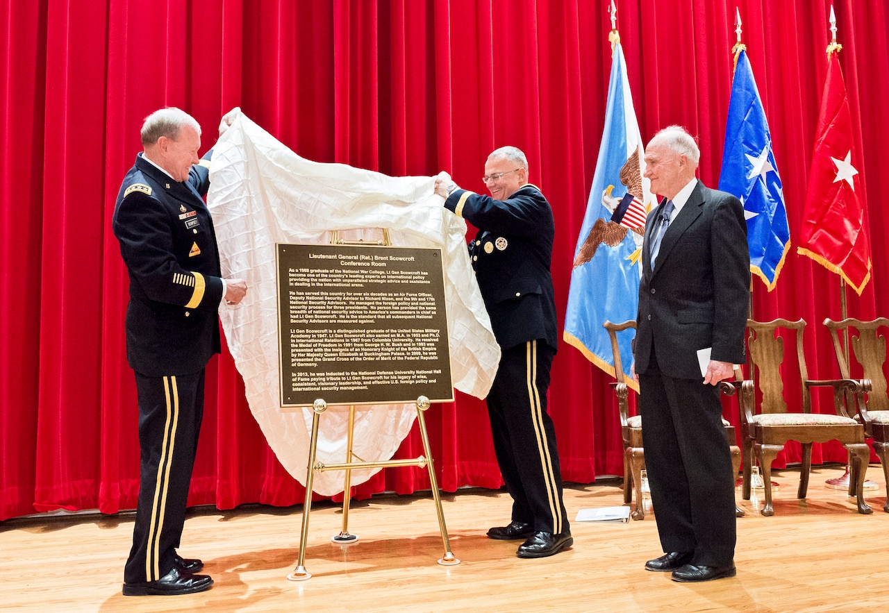 Army Gen. Martin E. Dempsey, chairman of the Joint Chiefs of Staff, left, and National War College Commandant Army Brig. Gen. Guy "Tom" Cosentino unveil a door placard to honor retired Air Force Lt. Gen. Brent Scowcroft during a dedication ceremony for Scowcroft at the National Defense University's National War College on Fort Lesley J. McNair in Washington, D.C., Jan. 13, 2015. The university hosted the event to officially dedicate a Roosevelt Hall room to Scowcroft, a former national security advisor. DoD photo by U.S. Army Staff Sgt. Sean K. Harp