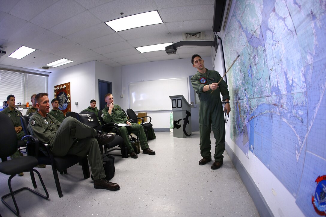 Marine Corps 1st Lt. Max C. Caggiano, right, gives a preflight brief in preparation for an external lift training exercise on Marine Corps Air Station Cherry Point, N.C., Jan. 7, 2015. 
Caggiano is a pilot assigned to the  Marine Heavy Helicopter Squadron 366. The training consisted of CH-53E Super Stallion helicopters and landing support Marines rehearsing the insertion and extraction of cargo through air support.