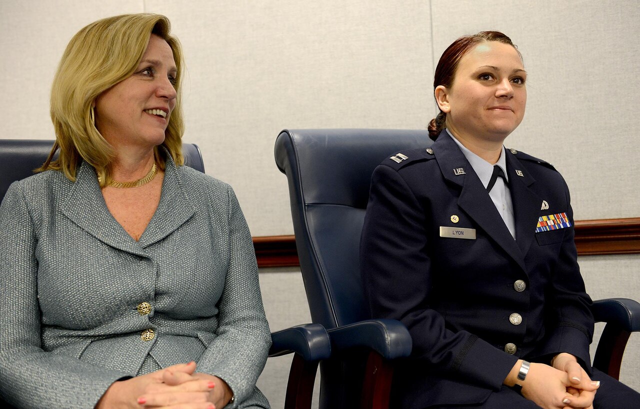 Secretary of the Air Force Deborah Lee James sits with Capt. Dana Lyon during the naming ceremony of the Motor Vessel Capt. David I. Lyon, Jan. 14, 2015, in the Pentagon.  The vessel was named in honor of Capt. David Lyon, who was killed in action Dec. 27, 2013, while serving in support of Operation Enduring Freedom.  (U.S. Air Force photo/Scott M. Ash)
