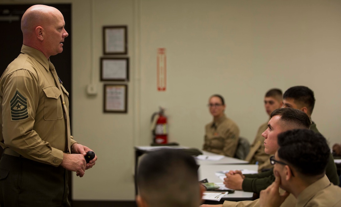 Sgt. Maj. Derek Fry, the Marine Aircraft Group 13 sergeant major and Lance Corporal Leadership and Ethics Seminar director, briefs an audience of Marines on the history of MAG-13 aboard Marine Corps Air Station Yuma, Ariz., Monday, Jan. 12, 2015. The seminar provided an opportunity to enhance the Marines’ leadership development through small group discussions with course instructors.