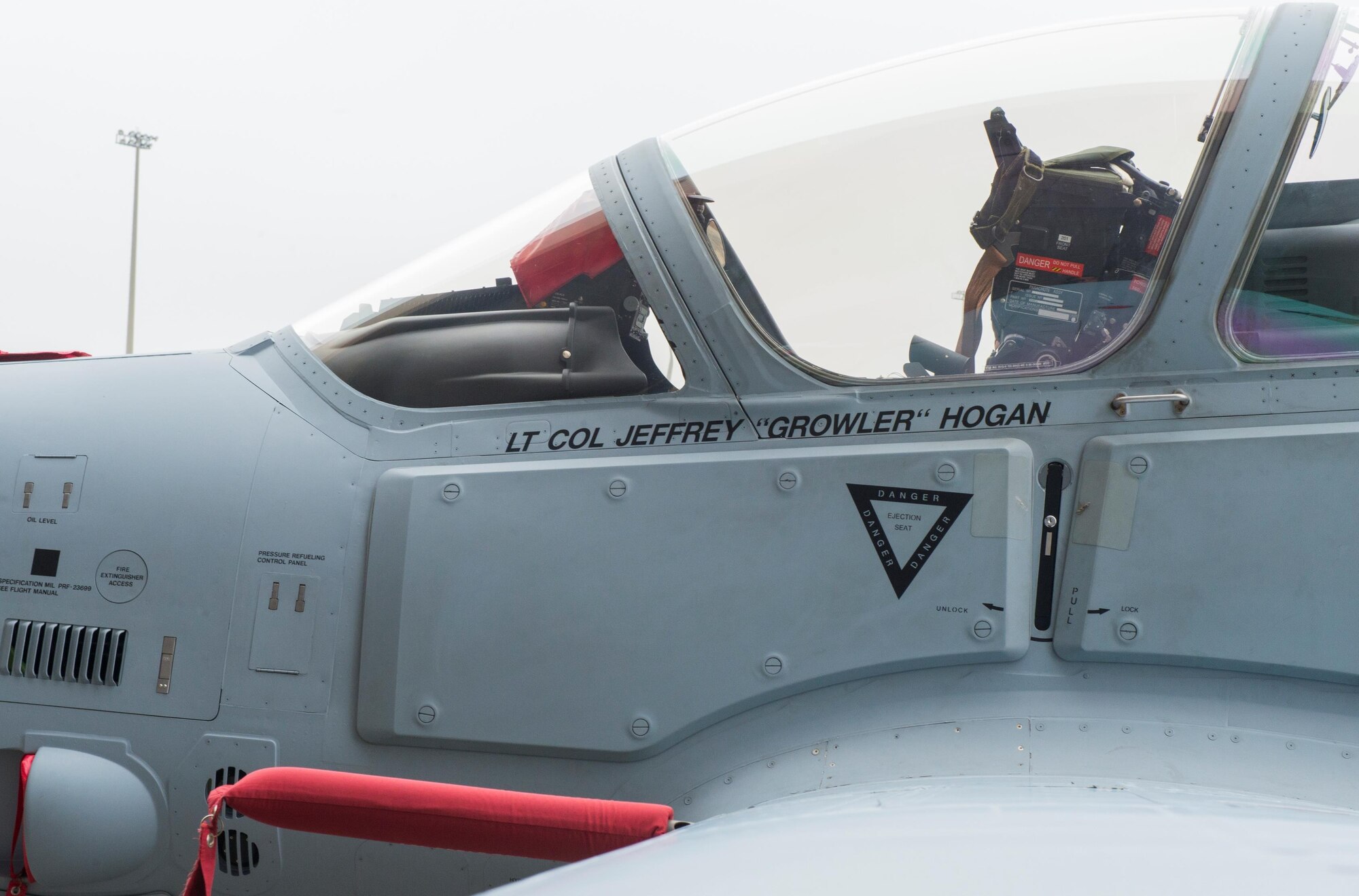 Lt. Col. Jeffrey "Growler" Hogan's name is unveiled on the side of an A-29 Super Tucano during a reactivation ceremony at Moody Air Force Base, Georgia Jan. 15, 2015. Hogan is the newest commander of the 81st Fighter Squadron, which will train Afghan pilots and maintainers through 2018. The A-29 is a light air support training aircraft that will be used to train 30 Afghan pilots and 90 Afghan maintainers as part of a requirement from the International Security Assistance Force. (U.S. Air Force photo by Airman 1st Class Ceaira Tinsley/Released)