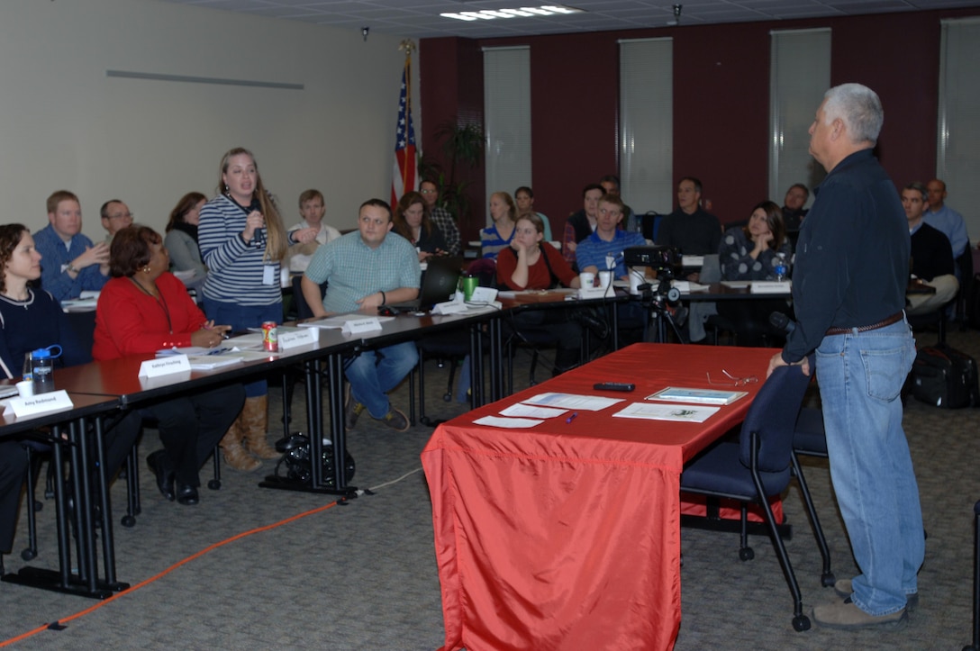 Chip Smith, assistant for Environment, Tribal and Regulatory Affairs in the Office of the Assistant Secretary of the Army for Civil Works, takes a question from Marsha K. Welch, an environmental archaeologist with the Tennessee Department of Transportation, during a presentation on the U.S. Army Corps of Engineers Program and Authorities for Tribal Nations during a workshop at the Estes Kefauver Federal Building Jan. 13, 2015 in Nashville, Tenn.