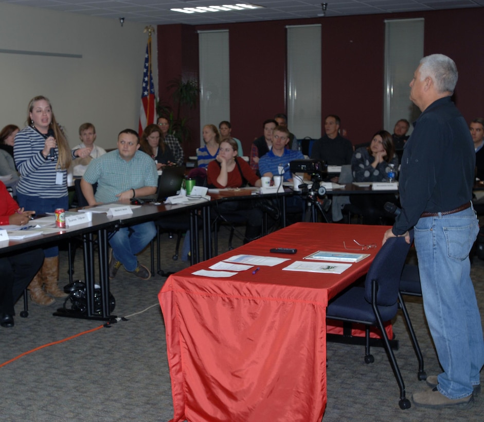 Chip Smith, assistant for Environment, Tribal and Regulatory Affairs in the Office of the Assistant Secretary of the Army for Civil Works, takes a question from Marsha K. Welch, an environmental archaeologist with the Tennessee Department of Transportation, during a presentation on the U.S. Army Corps of Engineers Program and Authorities for Tribal Nations during a workshop at the Estes Kefauver Federal Building Jan. 13, 2015 in Nashville, Tenn.  