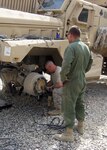 Members of the 1/172nd Cavalry assigned to the 86th Infantry Brigade Combat Team (Mountain) of the Vermont National Guard replace a damaged front axle on a Mine Resistant Ambush Protected vehicle at Forward Operating Base Vulcan, April 5, 2010. The team worked together and got the MRAP back in service after it was sidelined due to an Improvised Explosive Device.