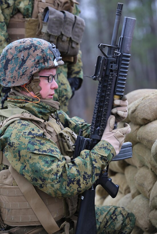 Cpl. Sierra K. Tilson, rifleman with 3rd Platoon, Company A, Ground Combat Element Integrated Task Force, loads a 40mm grenade into an M203 grenade launcher during a live-fire range at the Verona Loop training area, near Marine Corps Base Camp Lejeune, North Carolina, Jan. 14, 2015. Marines with Co. A conducted live-fire training, squad attacks, and patrolling in preparation for their upcoming assessment at Marine Corps Air Ground Combat Center Twentynine Palms, California. From October 2014 to July 2015, the GCEITF will conduct individual and collective level skills training in designated ground combat arms occupational specialties in order to facilitate the standards based assessment of the physical performance of Marines in a simulated operating environment performing specific ground combat arms tasks. (U.S. Marine Corps photo by Sgt. Alicia R. Leaders/Released)