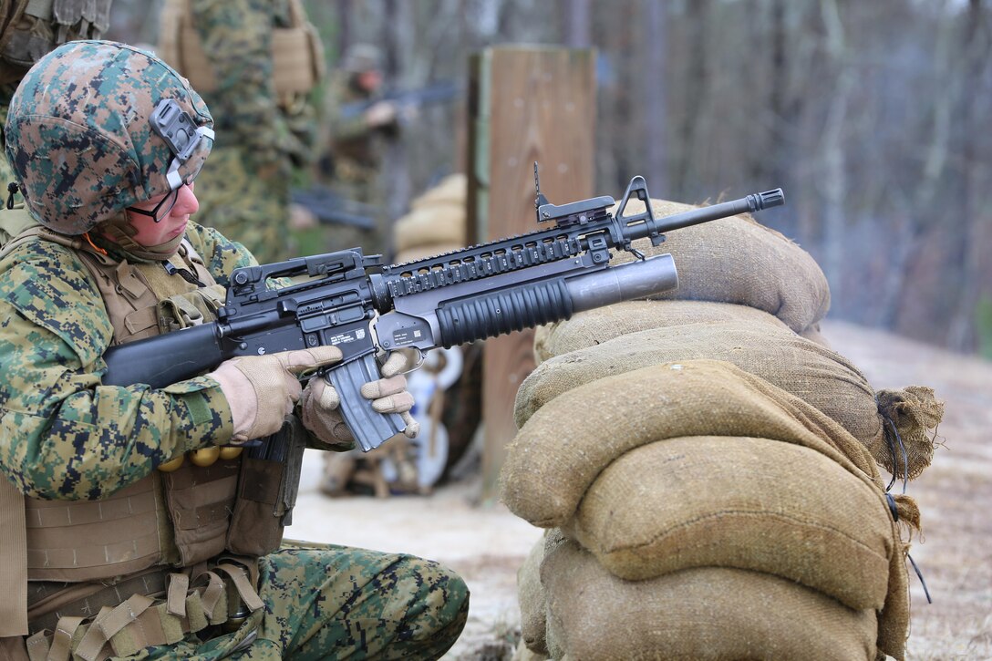 Cpl. Sierra K. Tilson, rifleman with 3rd Platoon, Company A, Ground Combat Element Integrated Task Force, fires the M203 grenade launcher during a live-fire range at the Verona Loop training area, near Marine Corps Base Camp Lejeune, North Carolina,  Jan. 14, 2015. Marines with Co. A conducted live-fire training, squad attacks, and patrolling in preparation for their upcoming assessment at Marine Corps Air Ground Combat Center Twentynine Palms, California. From October 2014 to July 2015, the GCEITF will conduct individual and collective level skills training in designated ground combat arms occupational specialties in order to facilitate the standards based assessment of the physical performance of Marines in a simulated operating environment performing specific ground combat arms tasks. (U.S. Marine Corps photo by Sgt. Alicia R. Leaders/Released)