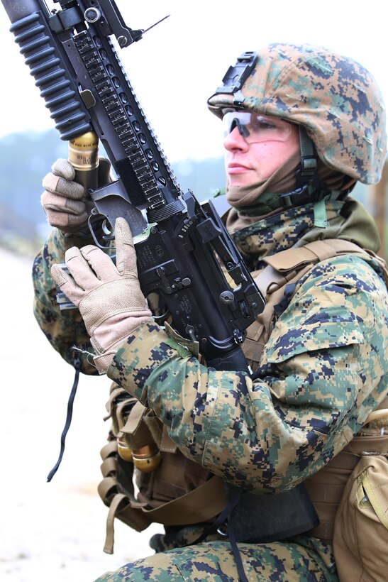 Sgt. Radmila M. Allen, team leader with 3rd Platoon, Company A, Ground Combat Element Integrated Task Force, loads a 40mm grenade into an M203 grenade launcher during a live-fire range at the Verona Loop training area, near Marine Corps Base Camp Lejeune, North Carolina, Jan. 14, 2015. Marines with Co. A conducted live-fire training, squad attacks, and patrolling in preparation for their upcoming assessment at Marine Corps Air Ground Combat Center Twentynine Palms, California. From October 2014 to July 2015, the GCEITF will conduct individual and collective level skills training in designated ground combat arms occupational specialties in order to facilitate the standards based assessment of the physical performance of Marines in a simulated operating environment performing specific ground combat arms tasks. (U.S. Marine Corps photo by Sgt. Alicia R. Leaders/Released)