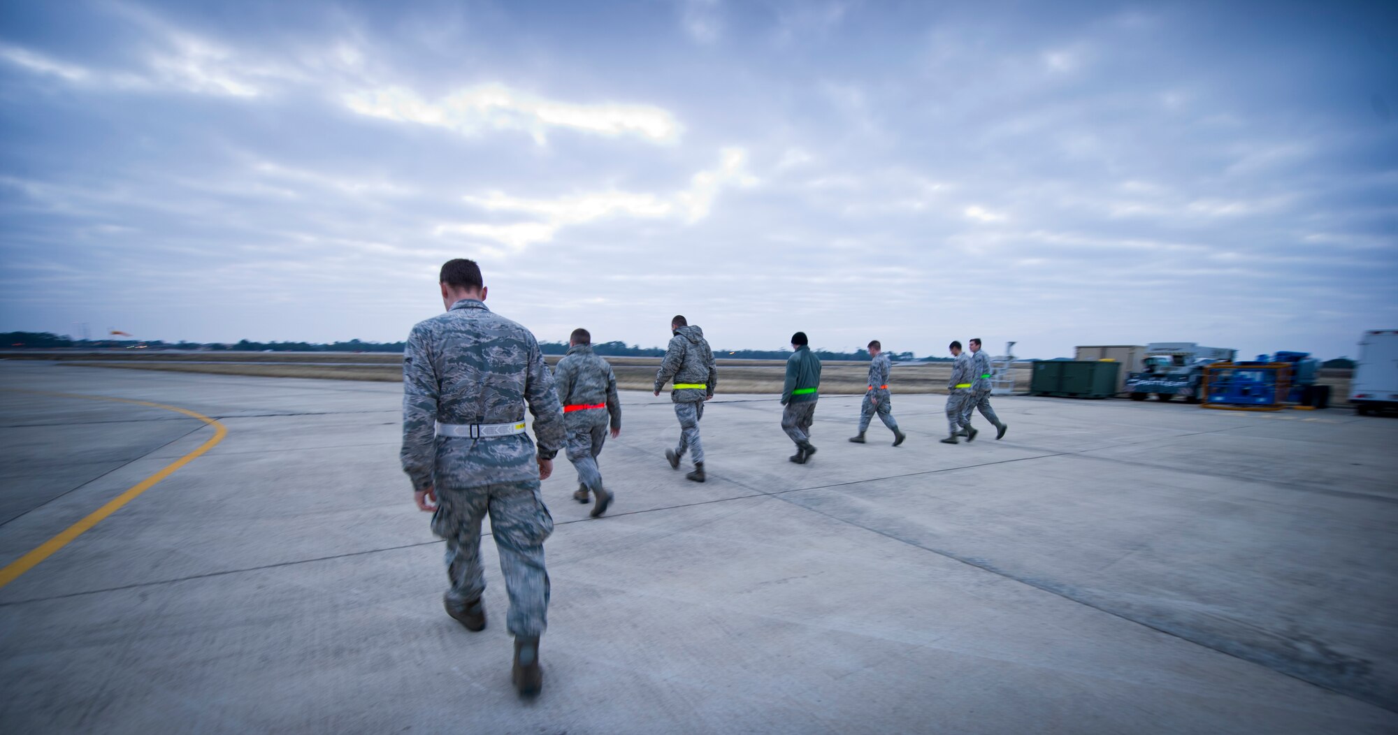 Airmen from the 901st Special Operations Maintenance Squadron conduct a Foreign Object Damage prevention walk on the flightline at Hurlburt Field, Fla., Jan. 14, 2015. Debris is considered anything that can cause damage to an aircraft. (U.S. Air Force photo/Senior Airman Krystal M. Garrett) 