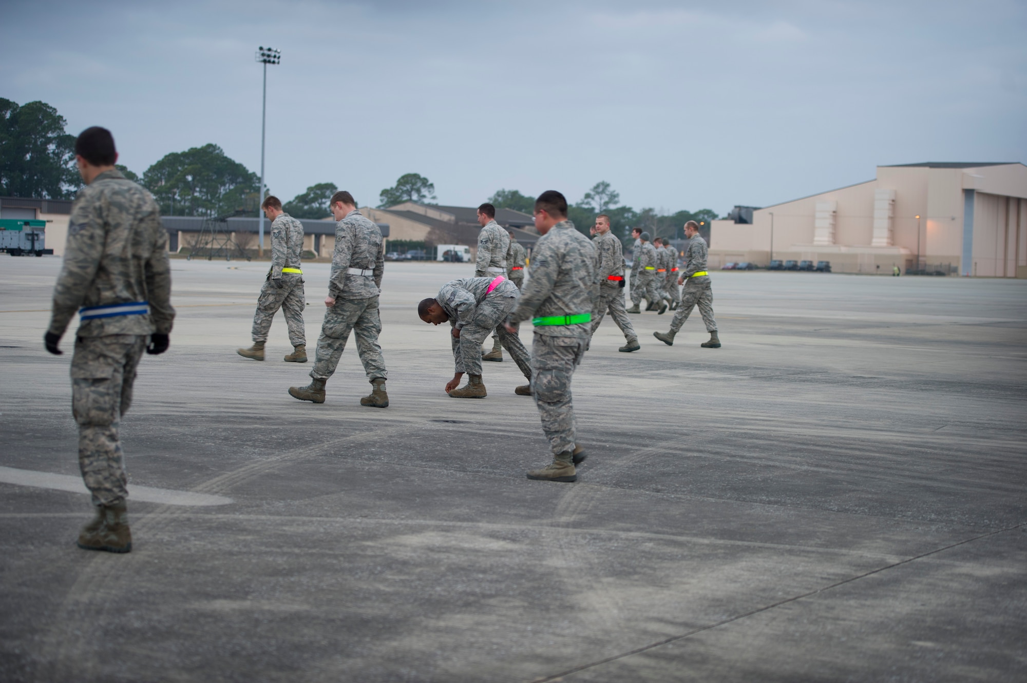 Airmen from the 901st Special Operations Maintenance Squadron conduct a Foreign Object Damage prevention walk on the flightline at Hurlburt Field, Fla., Jan. 14, 2015. Debris is considered anything that can cause damage to an aircraft. (U.S. Air Force photo/Senior Airman Krystal M. Garrett) 
