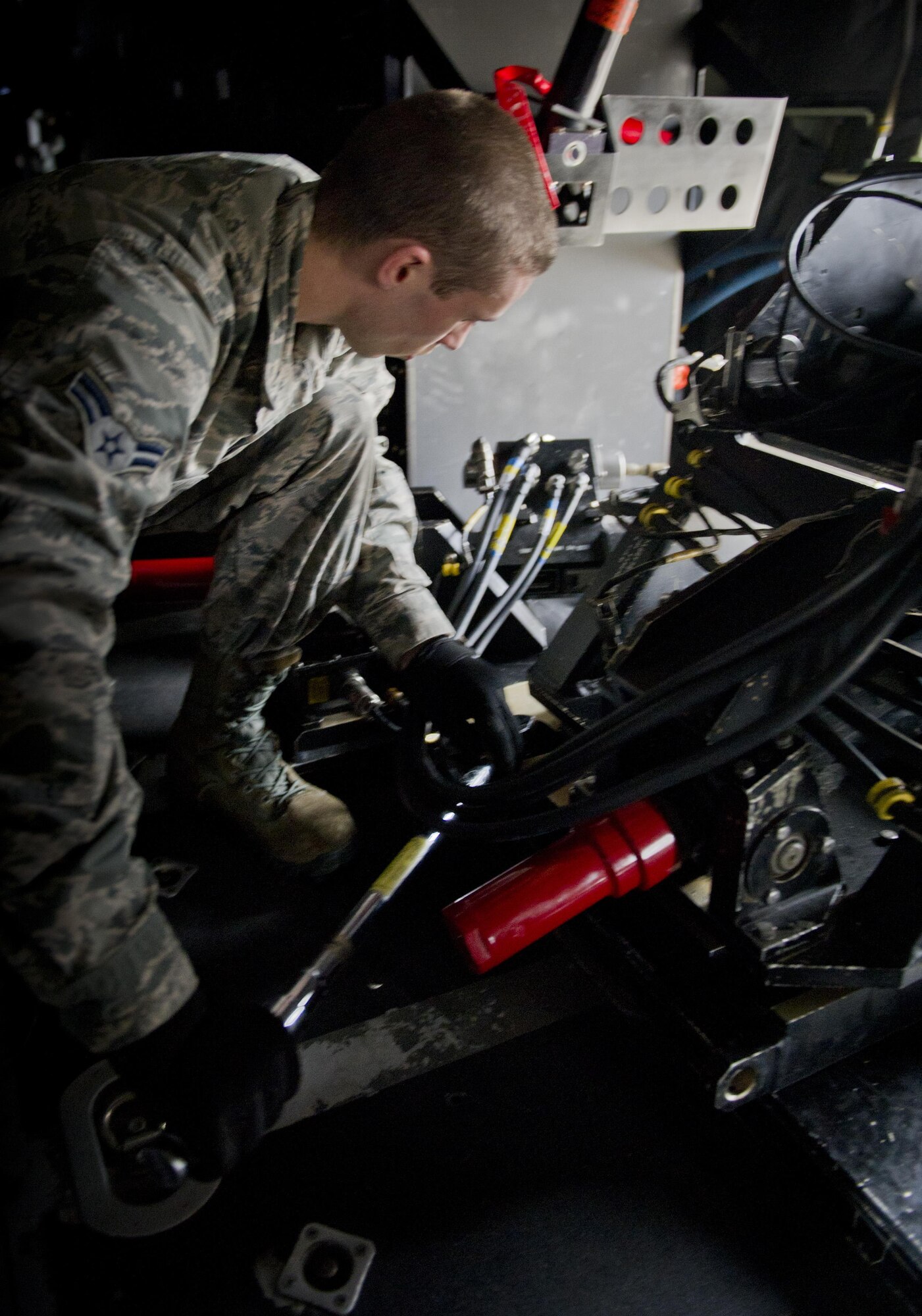 Austyn Spray, 1st Special Operations Aircraft Maintenance Squadron weapons load crew member, secures a 25mm Gatling gun on an AC-130U Gunship on the flightline at Hurlburt Field, Fla., Jan. 12, 2015. The Gatling gun is one of three weapon systems on the AC-130U. (U.S. Air Force photo/Senior Airman Krystal M. Garrett)