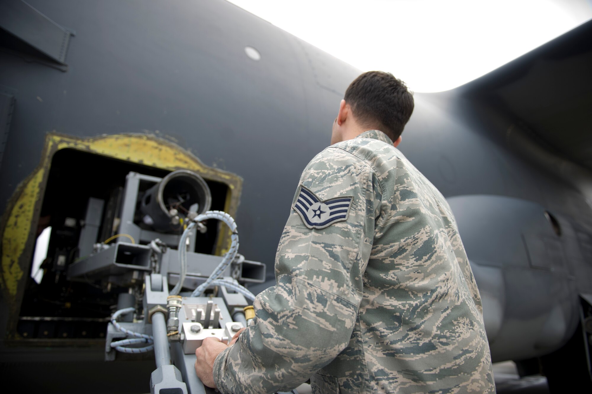 Staff Sgt. Ronnie Simons, 1st Special Operations Aircraft Maintenance Squadron weapons load team chief, inserts a 25mm Gatling gun into an AC-130U Gunship on the flightline at Hurlburt Field, Fla., Jan. 12, 2015. The Gatling gun can hold up to 3,000 rounds. (U.S. Air Force photo/Senior Airman Krystal M. Garrett)