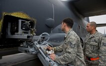 Staff Sgt. Ronnie Simons, 1st Special Operations Aircraft Maintenance Squadron weapons load team chief, inserts a 25mm Gatling gun into an AC-130U Gunship on the flightline at Hurlburt Field, Fla., Jan. 12, 2015. The Gatling gun goes through an inspection and has a barrel swap every 18,000 rounds. (U.S. Air Force photo/Senior Airman Krystal M. Garrett)