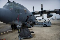 Airmen from the 1st Special Operations Aircraft Maintenance Squadron weapons load crew team, insert a 25mm Gatling gun into an AC-130U Gunship on the flightline at Hurlburt Field, Fla., Jan. 12, 2015. The weapons flight Airmen fix and maintain the weapons systems on the AC-130. (U.S. Air Force photo/Senior Airman Krystal M. Garrett) 