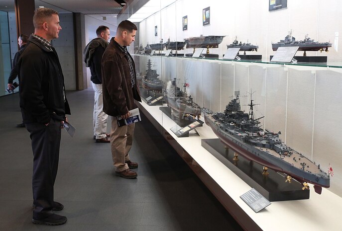 Col. Robert V. Boucher, commanding officer of Marine Corps Air Station Iwakuni, Japan, and Sgt. Maj. Keith Massi, sergeant major of MCAS Iwakuni, view replica models of Japanese battleships, aircraft carriers and destroyers while visiting the Kure Maritime Museum in Kure, Hiroshima, Jan. 14, 2015. Maj. Gen. Charles Hudson, commanding general of Marine Corps Installations Pacific, gathered installation commanders, senior enlisted advisors and principle staff aboard MCAS Iwakuni, for the quarterly MCIPAC Camp Commander’s Conference, Jan. 12-15, 2015.