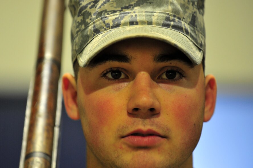 U.S. Air Force Airman 1st Class William Klein, 35th Civil Engineer Squadron pavements and construction equipment journeyman, stands guard during a Base Honor Guard practice at Misawa Air Base, Japan, Jan. 14, 2015. Klein practices the colors ceremony as one of two rifle guards for those posting the flags on the poles. Rifle guards require meticulous discipline and bearing to maintain steady posture during ceremonies. (U.S. Air Force photo by Senior Airman Jose L. Hernandez-Domitilo/Released)