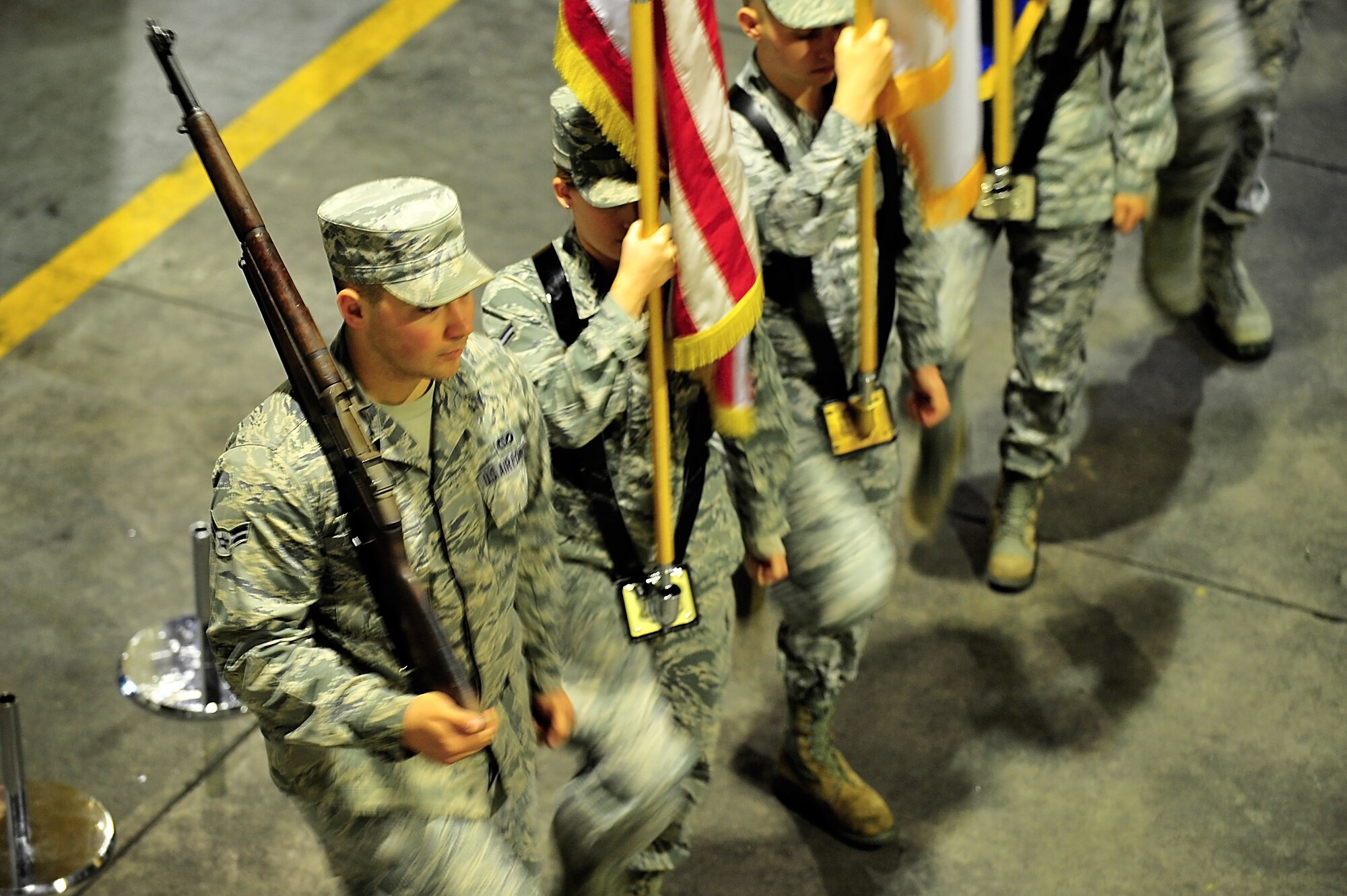 A group of Base Honor Guard Airmen rehearse presenting the colors during a practice session at Misawa Air Base, Japan, Jan. 14, 2015. This detail typically requires a four-member team; however, a bearer with the Japanese flag is also incorporated at ceremonies here as tribute to the host nation. (U.S. Air Force photo by Senior Airman Jose L. Hernandez-Domitilo/Released)