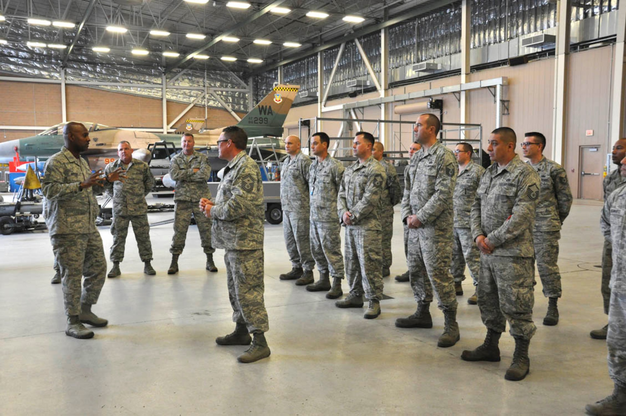 (Far left) Chief Master Sergeant Cameron Kirksey, Command Chief Master Sergeant, Air Force Reserve Command, addresses the 926th Aircraft Maintenance Squadron on the importance of the Community College of the Air Force degree program inside the Viper hangar Jan. 11. (U.S. Air Force photo/Maj. Jessica Martin)