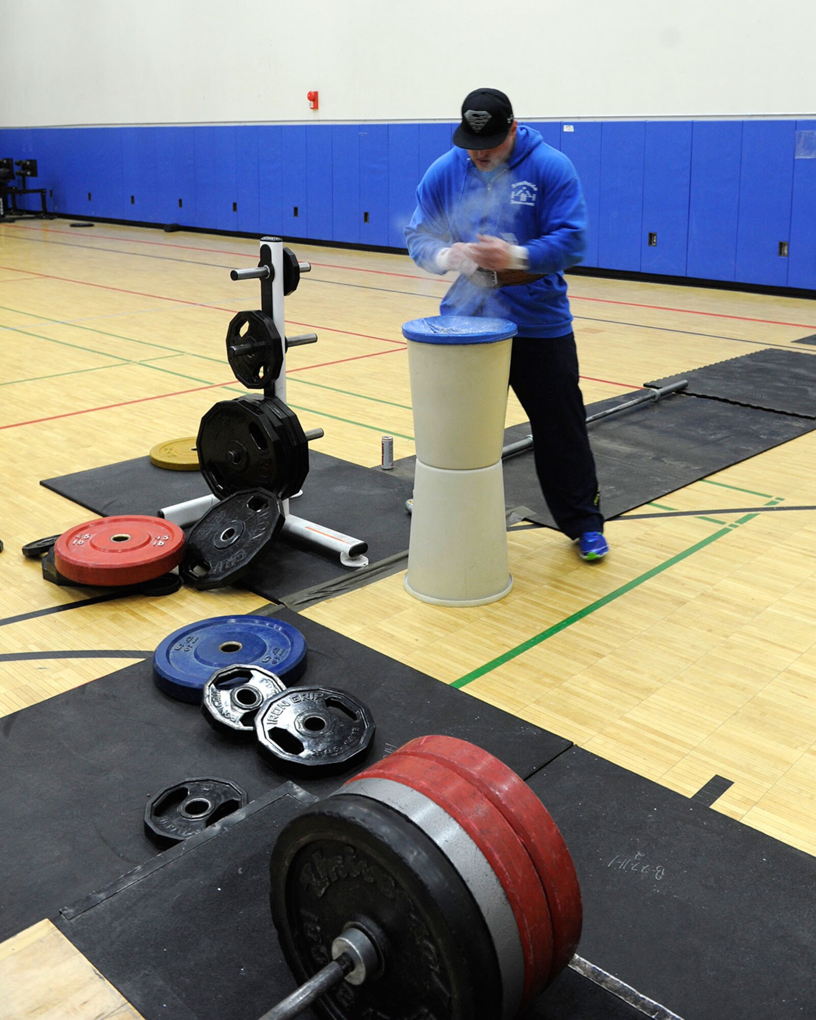 Army Sgt. Randy Cole, senior combatives instructor at the Arctic Warrior Combatives Center, chalks his hands before attempting to deadlift 640 pounds during the Third Annual Arctic Warrior Push/Pull competition at Buckner Physical Fitness Center Jan. 10. Cole had the heaviest deadlift in the competition and is the reigning Alaska Strongest Man. The event’s goal is to promote strength and esprit de corps. (U.S. Air Force photo/Staff Sgt. Wes Wright)