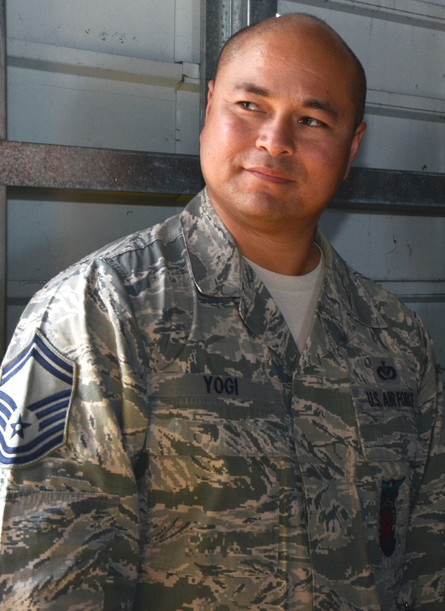 Chief Master Sgt. Desmond Yogi, assistant fire chief with the 624th Civil Engineering Squadron, 624th Regional Support Group, Joint Base Pearl Harbor-Hickam, Hawai'i, observes a live-fire training exercise his unit held at Hickam Field, Jan. 10, 2015. In his civilian capacity, Chief Yogi works for the Honolulu Airport fire department. (U.S. Air Force photo by Tech. Sgt. Phyllis Keith)