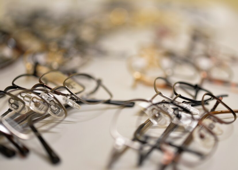 Eye glass frames lay on the table at the Creech Optometry Clinic Jan. 13, 2015, at Creech Air Force Base, Nevada. The Creech Medical Aid station now offers optometry services such as routine eye examinations, acute visits, limited contact lens prescriptions renewals and follow-up exams every Tuesday from 7:30 a.m. to 3 p.m. (U.S. Air Force photo by Staff Sgt. Adawn Kelsey/Released)