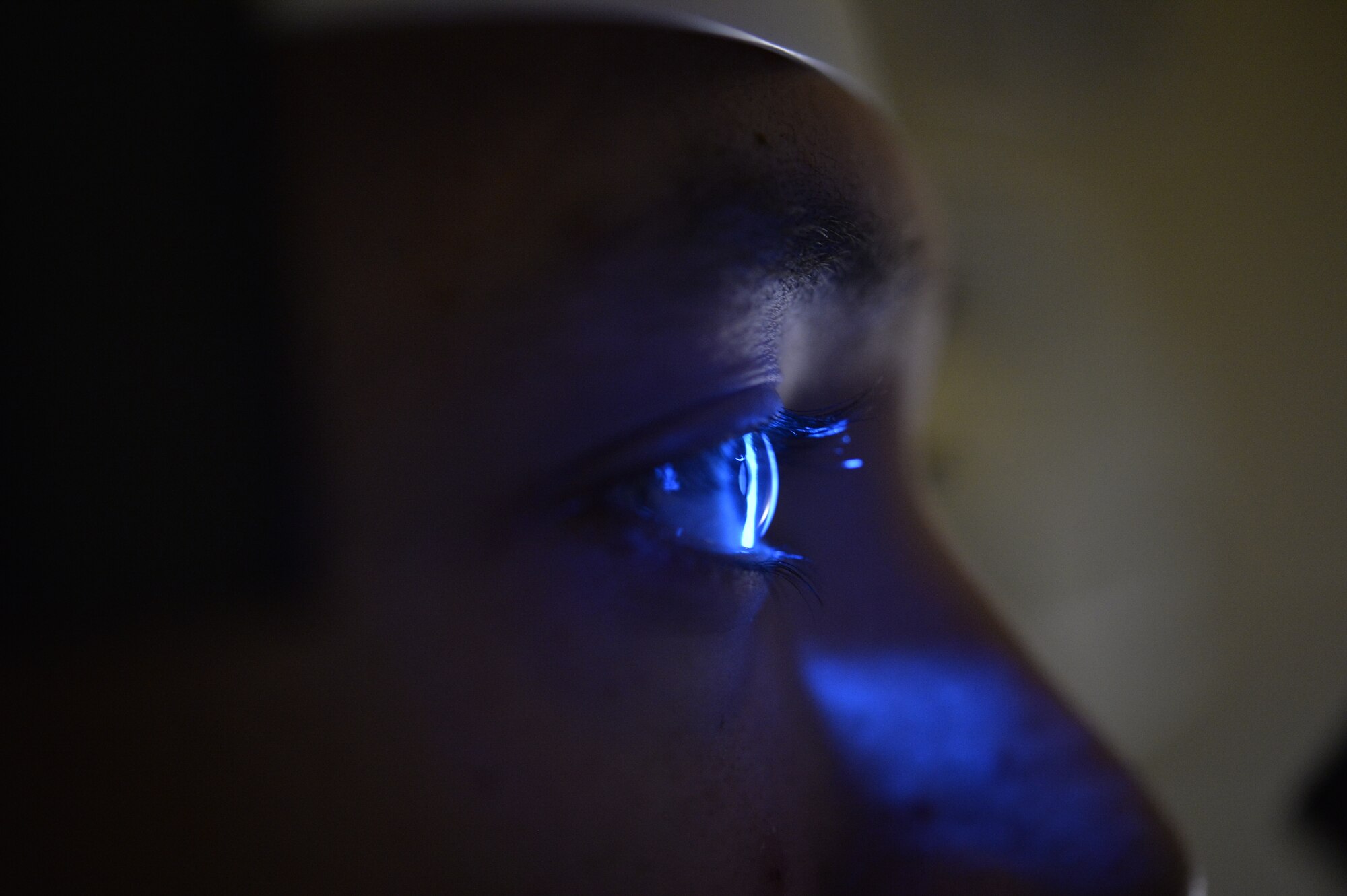 Maj. Ivy Madson, 99th Air Base Squadron optometry flight commander, uses a Slit Lamp to examine the interior of the eye during an exam for Airman 1st Class Hunter, 18th Reconnaissance Squadron Airman, Jan. 13, 2015, at Creech Air Force Base, Nevada. The Creech Medical Aid Station now offers optometry services to all personnel assigned to Creech AFB Tuesdays from 7:30 a.m. to 3 p.m. (Last names have been withheld for security purposes). (U.S. Air Force photo by Staff Sgt. Adawn Kelsey/Released)