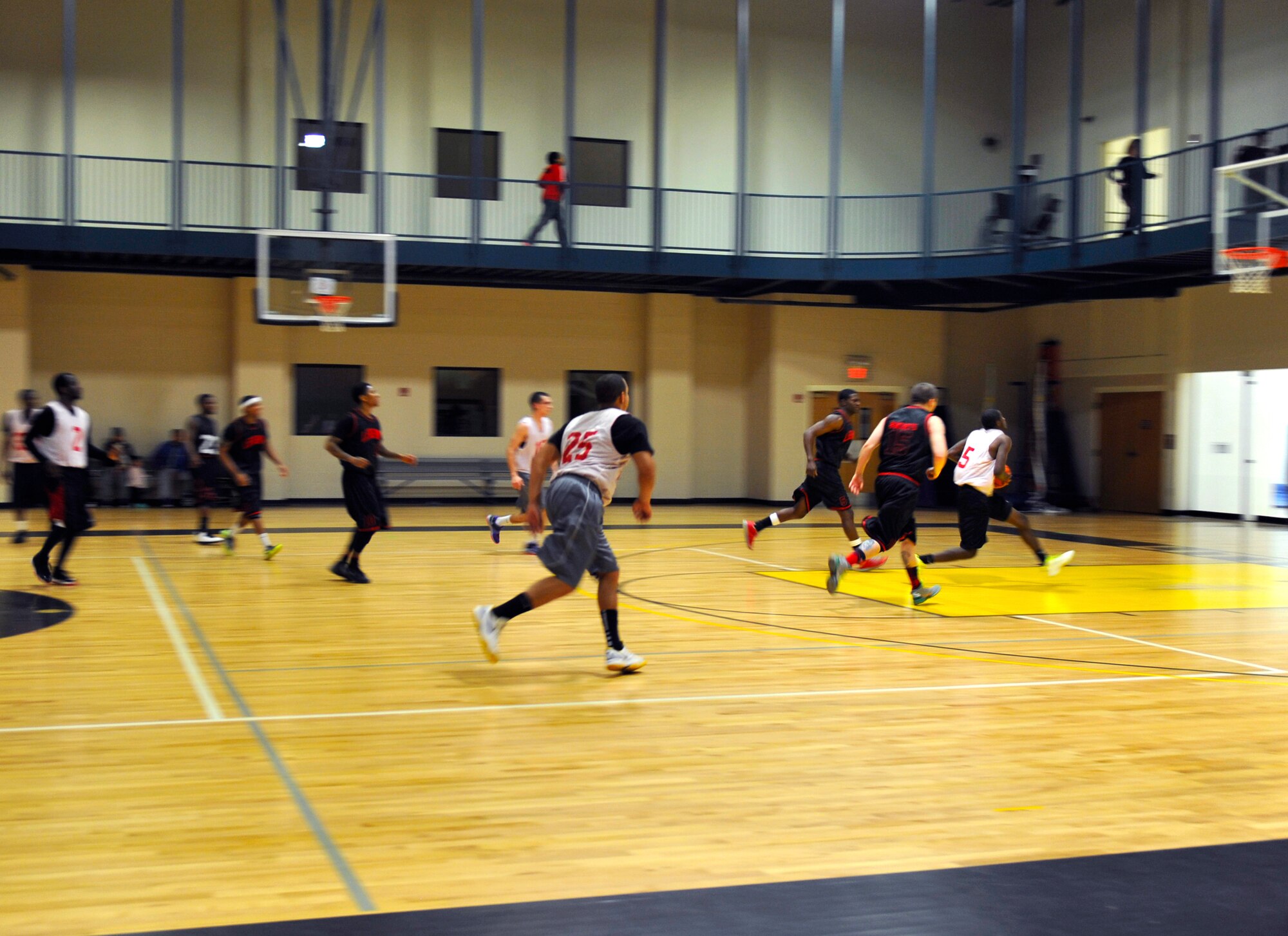 A 19th Force Support Squadron player drives the lane for a layup Jan. 12, 2015, at Little Rock Air Force Base, Ark. This season 10 teams will make it to the playoffs to compete for the championship. (U.S. Air Force photo by Senior Airman Stephanie Serrano)