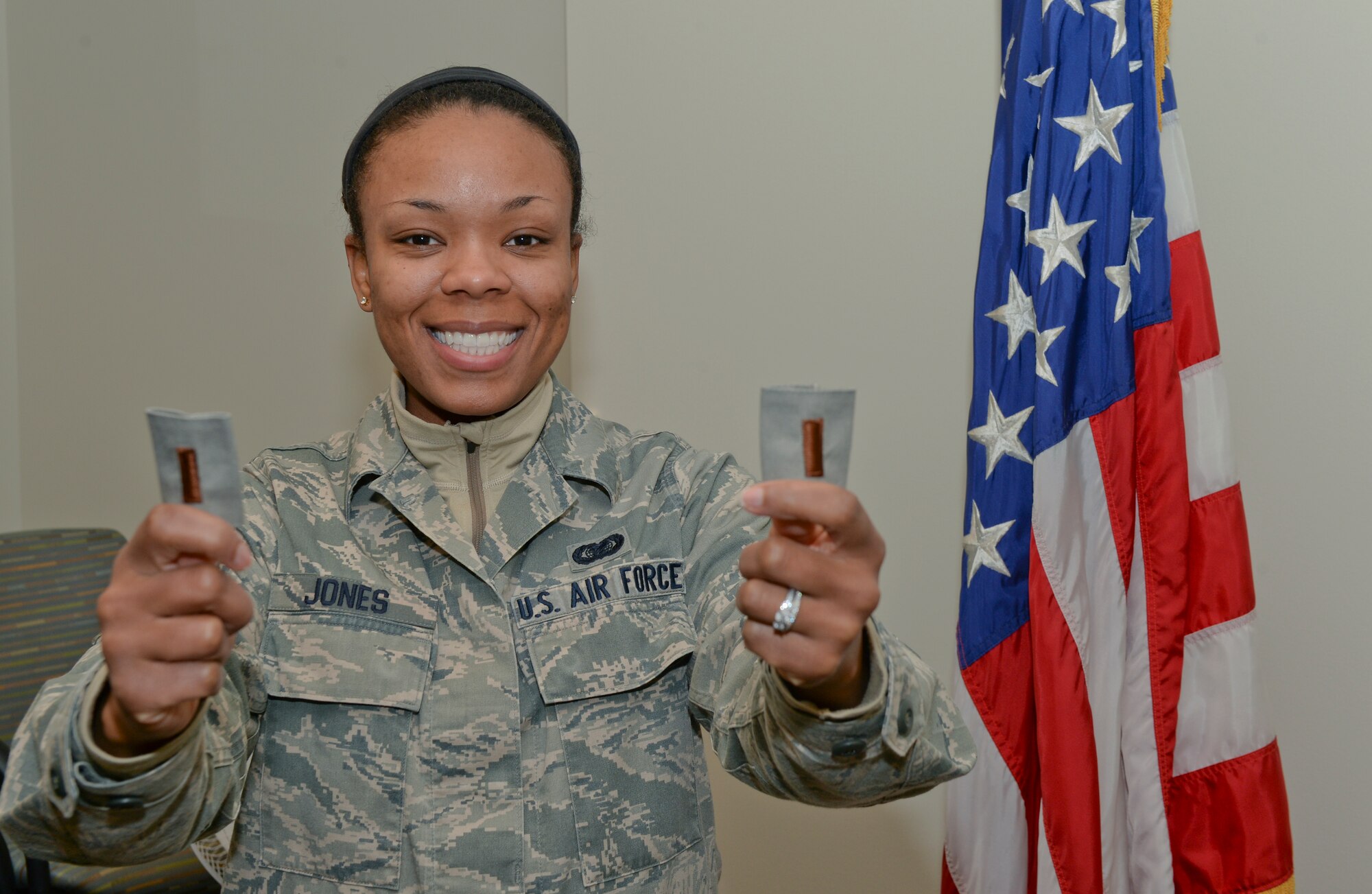 Staff Sgt. Marvina Jones, 22nd Maintenance Squadron commander’s support staff assistant NCO in-charge, poses with 2nd Lieutenant ranks Jan. 14, 2015, at McConnell Air Force Base, Kan. Jones has been accepted into the Air Force Commissioned Officer Training program and will be commissioned during the first week of February. (U.S. Air Force photo/Senior Airman Colby L. Hardin)