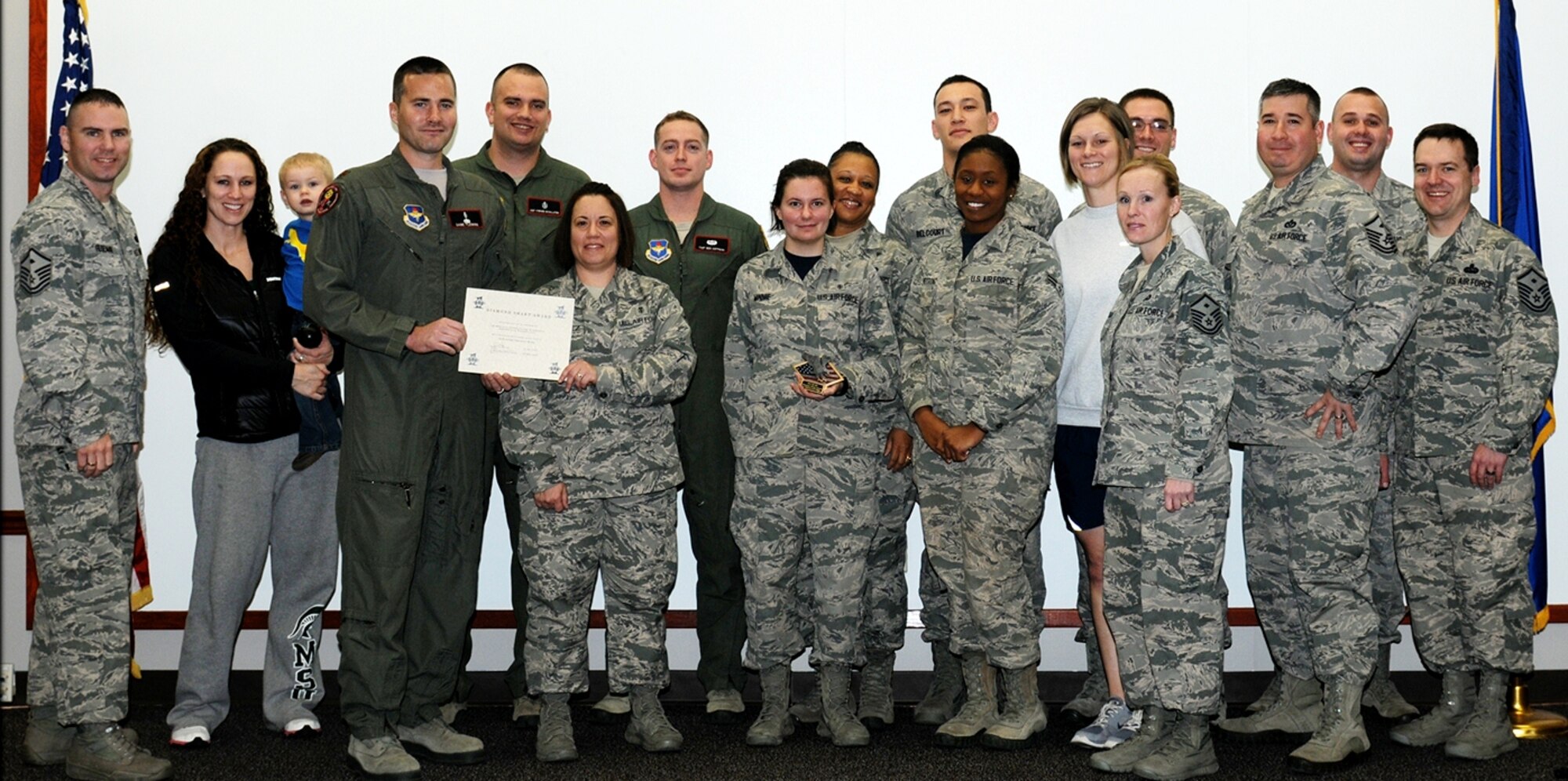 The 14th Medical Operations Squadron Aerospace Medicine flight is presented the Diamond Sharp Award for the fourth quarter of 2014 by Team BLAZE first sergeants Dec. 19 at Columbus Air Force Base, Mississippi. The Diamond Sharp Award is a way for the first sergeants on base to pick an individual or team and recognize them for outstanding performance. (U.S. Air Force photo/Melissa Doublin)