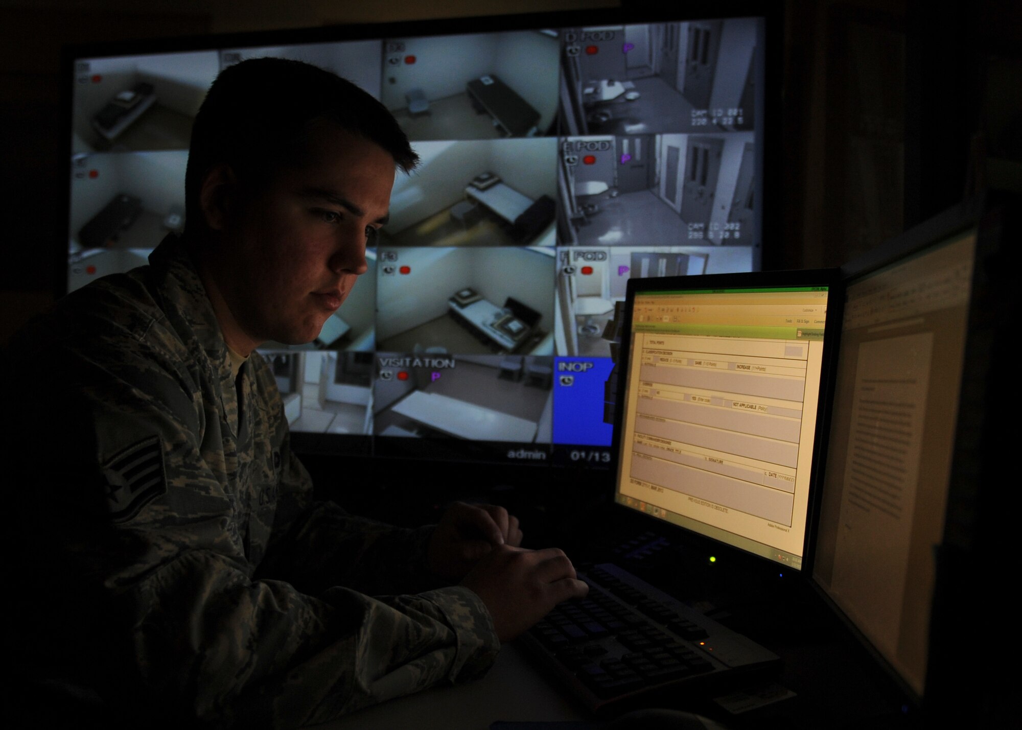 Staff Sgt. Thomas Hodges, the 19th Security Forces Squadron noncommissioned officer-in-charge of confinement, updates inmates’ personal deposit funds Jan. 13, 2015, at Little Rock Air Force Base, Ark. Inmates are required to pay for their own hygiene items to include haircuts while they are still being paid by the government. (U.S. Air Force photo by Airman 1st Class Scott Poe) 