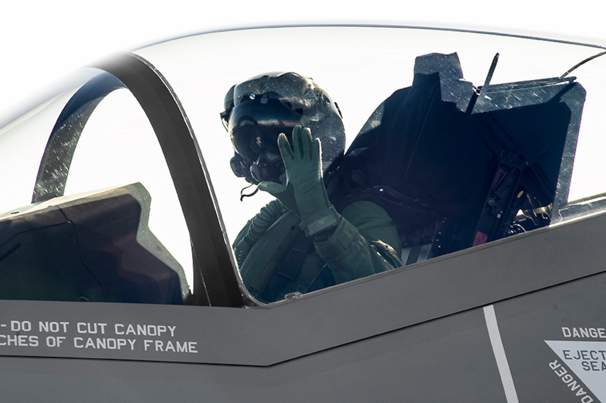 Capt. Brent Golden, 16th Weapons Squadron instructor, waves to the ground crew as he departs in the U.S. Air Force Weapons School’s first assigned F-35A Lightning II at the Lockheed Martin plant in Fort Worth, Texas, Jan. 15, 2015. Working in conjunction with the U.S. Air Force Warfare Center and 422nd Test and Evaluation Squadron, the USAFWS’ first F-35 will be used to drive tactics development. (Photo by Angel DelCueto, Lockheed Martin)