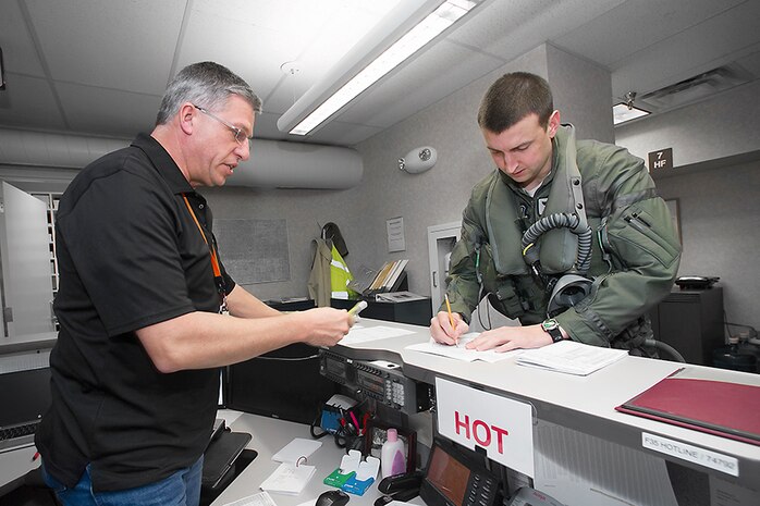 Capt. Brent Golden, 16th Weapons Squadron instructor, completes his life support checklist prior to piloting the Air Force Weapons School’s first assigned F-35A Lightning II to Nellis Air Force Base, Nev., from Fort Worth, Texas, Jan. 15, 2015. The first F-35A USAFWS student course is tentatively scheduled for January 2018. (Photo by Angel DelCueto, Lockheed Martin)