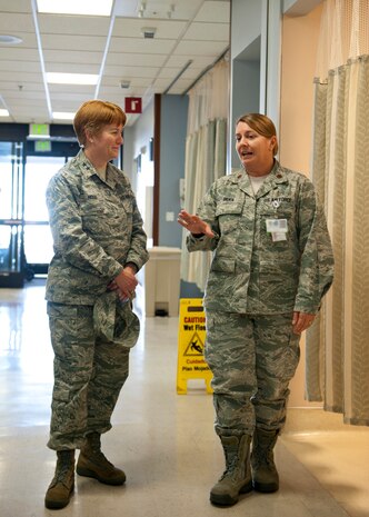 Maj. Gen. Dorothy Hogg (left), U.S. Air Force director of medical operations and research and chief of the nurse corps, listens to Maj. Kristin Silvia, 99th Medical Operations Squadron emergency services flight commander, give a briefing of the emergency room at the Mike O’Callaghan Federal Medical Center at Nellis Air Force Base, Nev., Jan. 13, 2015. Hogg was visiting Nellis to discuss the benefits of the Sustained Medical and Readiness Trained, or SMART, program which allows Air Force physicians, nurses and medical technicians the opportunity to improve their skills in a civilian hospital, which could later be used on the battlefield. (U.S. Air Force photo illustration by Senior Airman Thomas Spangler) 
