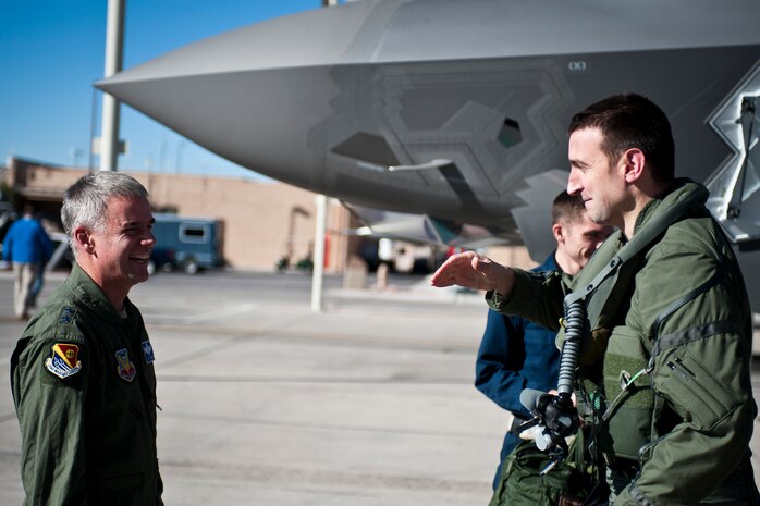 Maj. Gen. Jay Silveria (left), U.S. Air Force Warfare Center commander, greets Capt. Brent Golden, 16th Weapons Squadron instructor, after Golden’s flight in the U.S. Air Force Weapons School’s first assigned F-35A Lightning II at Nellis Air Force Base, Nev., Jan. 15, 2015. While the first and subsequent USAFWS-assigned F-35s will initially operate under the umbrella of the 16th WPS, the F-35 Weapons School cadre will be built out of experts from every mission design series. (U.S. Air Force photo by Staff Sgt. Siuta B. Ika)