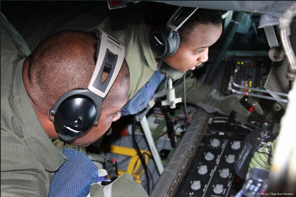 Airman 1st Class Andre McClain, a boom operator with the 171st Air Refueling Squadron, conducts an aerial refueling operation in a KC-135 Stratotanker while under the supervision of Master Sgt. George Hall, Jan. 13, 2014. McClain is a relatively recent addition to the 171st after initially joining the Michigan Air National Guard as a personnel specialist with the 127th Force Support Squadron. (U.S. Air National Guard photo by Tech. Sgt. Dan Heaton)